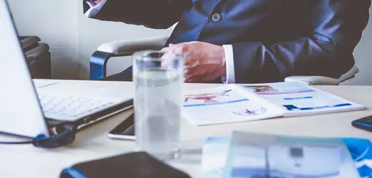 Man in suit using cell phone